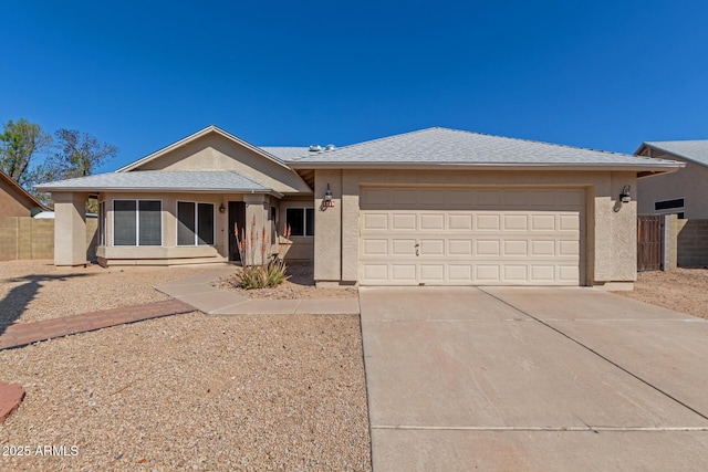 single story home featuring stucco siding, a shingled roof, concrete driveway, and a garage