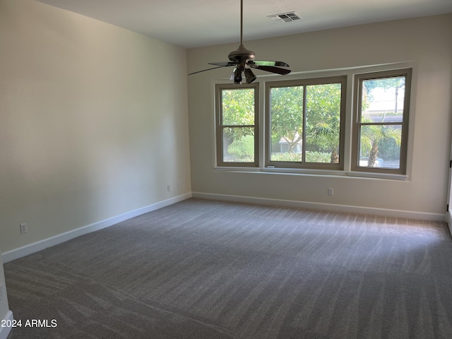 spare room with ceiling fan and carpet flooring