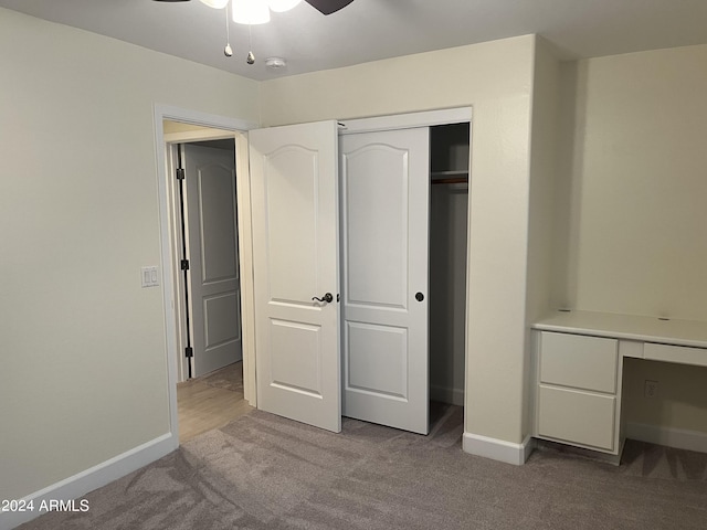 unfurnished bedroom with ceiling fan and carpet