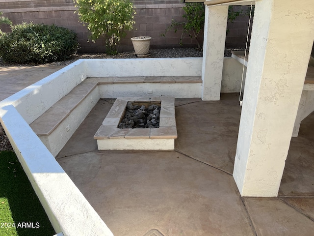 view of patio / terrace with an outdoor fire pit