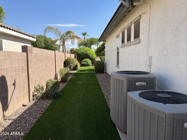 view of yard featuring central air condition unit