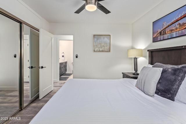 8522 E Virginia Ave, Scottsdale, AZ 85257 - bedroom featuring wood finished floors, ensuite bath, baseboards, a ceiling fan, and a closet