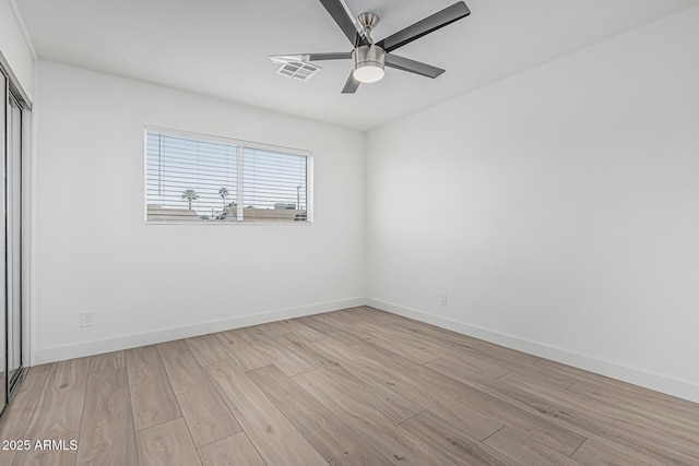 8522 E Virginia Ave, Scottsdale, AZ 85257 - unfurnished room featuring light wood-type flooring, ceiling fan, and baseboards