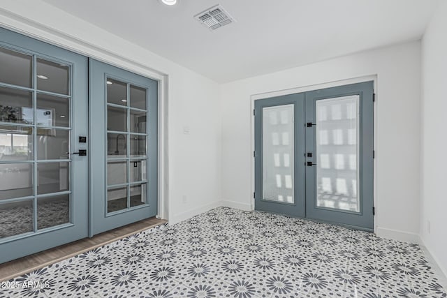 8522 E Virginia Ave, Scottsdale, AZ 85257 - foyer entrance with french doors and baseboards