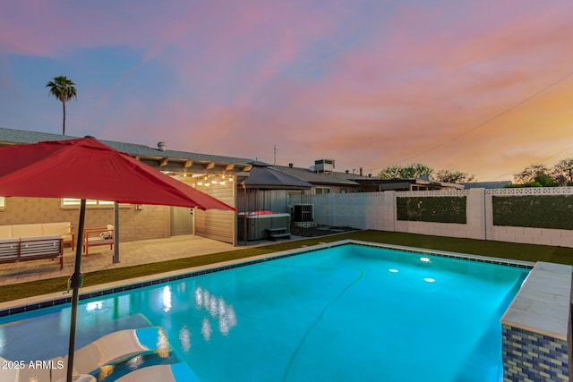8522 E Virginia Ave, Scottsdale, AZ 85257 - pool at dusk featuring a fenced backyard, a jacuzzi, and a patio area