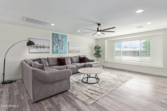 8522 E Virginia Ave, Scottsdale, AZ 85257 - living room featuring wood finished floors, a ceiling fan, recessed lighting, and baseboards