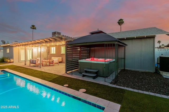 8522 E Virginia Ave, Scottsdale, AZ 85257 - back of property with a hot tub, a gazebo, outdoor lounge area, and a patio area