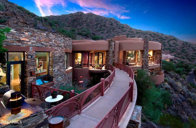 view of front of home featuring a mountain view