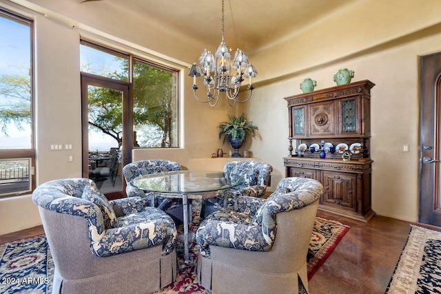 dining space featuring plenty of natural light and a notable chandelier