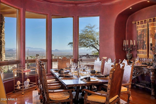 dining space with a mountain view and wood-type flooring