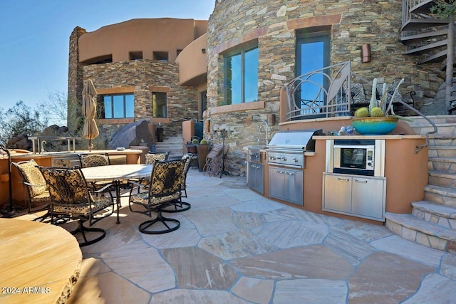 view of patio featuring a grill and area for grilling