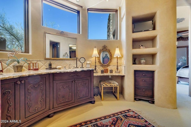 bathroom with vanity and built in features