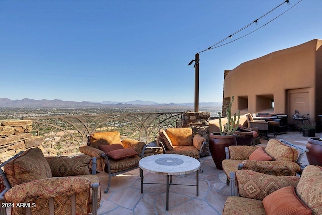 view of patio / terrace featuring a mountain view and a balcony