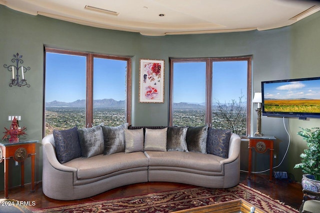 living room featuring plenty of natural light and dark wood-type flooring