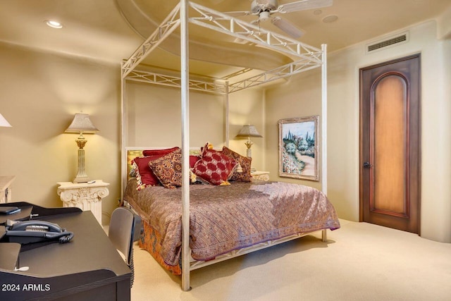 bedroom with ceiling fan and carpet floors