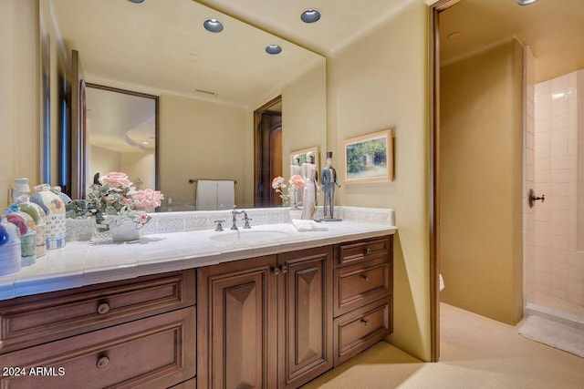 bathroom with vanity and a shower