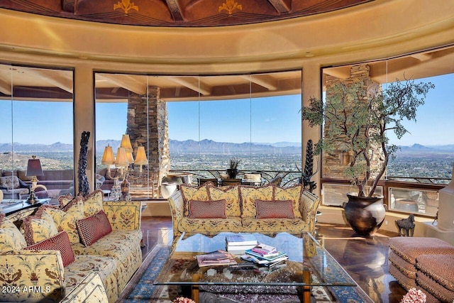 sunroom with a mountain view and plenty of natural light