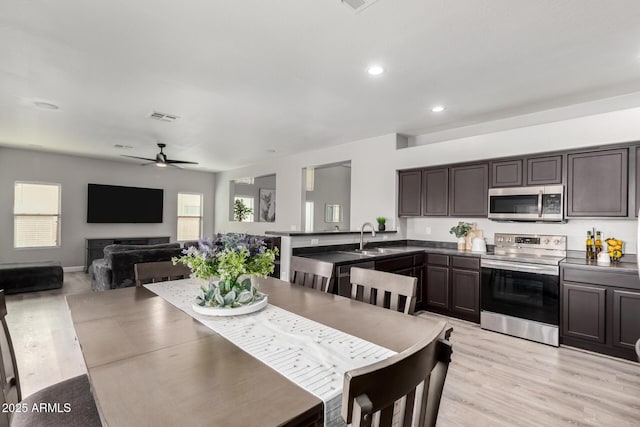 dining area featuring recessed lighting, visible vents, light wood-style flooring, and a ceiling fan