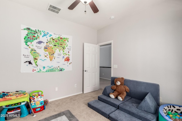 game room featuring baseboards, visible vents, a ceiling fan, and carpet