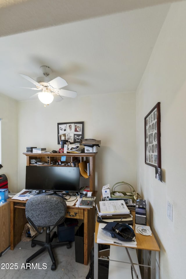 office space with ceiling fan and concrete floors