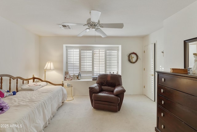 bedroom featuring ceiling fan and light colored carpet