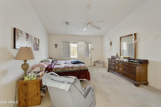 carpeted bedroom with vaulted ceiling and ceiling fan