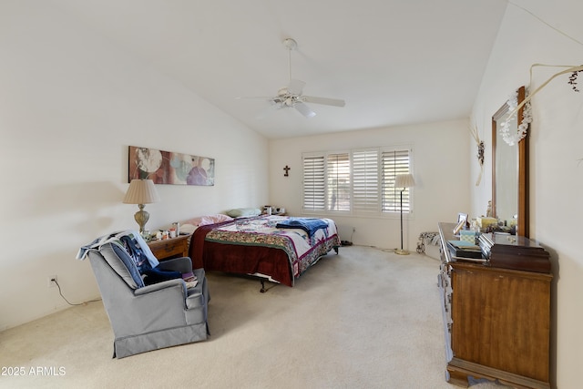 carpeted bedroom with vaulted ceiling and ceiling fan