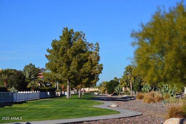 view of home's community featuring a lawn