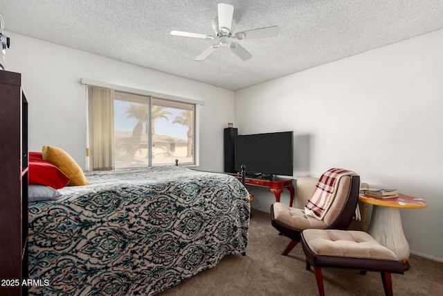 carpeted bedroom featuring ceiling fan and a textured ceiling