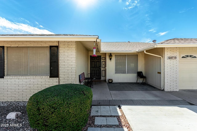 doorway to property featuring a garage