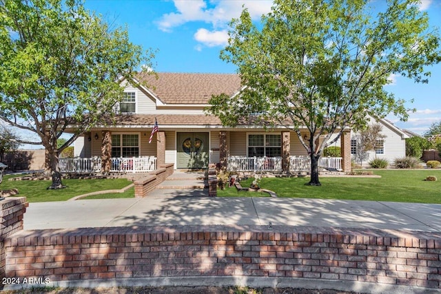 view of front of property with a porch and a front lawn