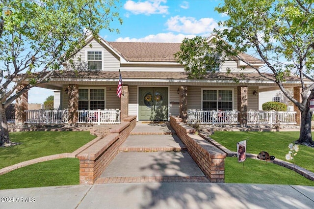 farmhouse with a porch and a front yard