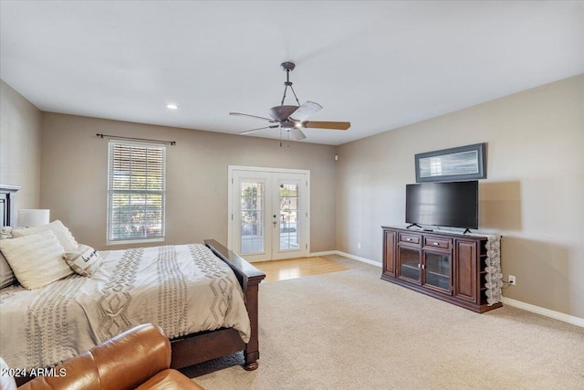 carpeted bedroom with french doors, access to outside, and ceiling fan