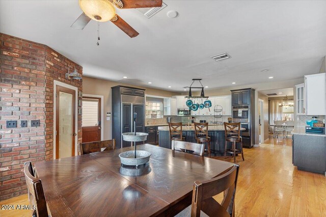 dining room featuring ceiling fan and light hardwood / wood-style flooring