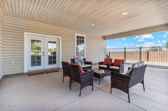 view of patio / terrace with french doors and an outdoor living space