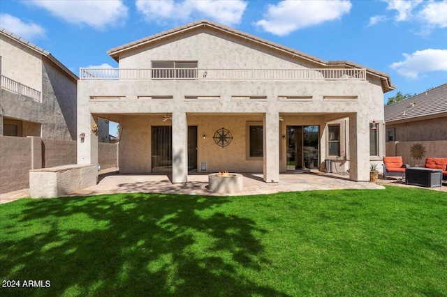 back of property featuring an outdoor living space, a yard, a balcony, a patio area, and cooling unit