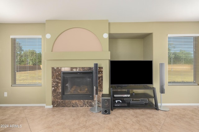 living room featuring tile patterned floors and a fireplace