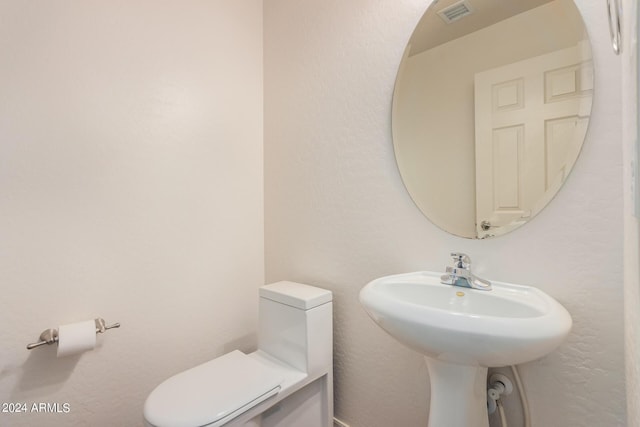 bathroom featuring sink and toilet