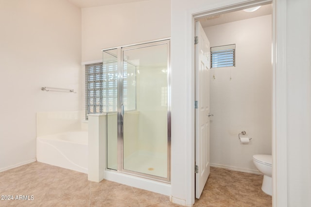 bathroom with tile patterned floors, plus walk in shower, and toilet