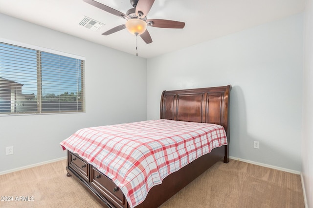 bedroom featuring ceiling fan and light colored carpet