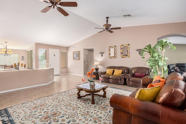 tiled living room featuring ceiling fan with notable chandelier and lofted ceiling