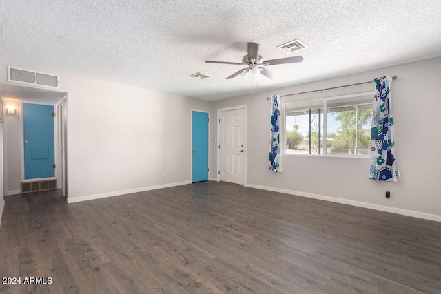 unfurnished room featuring ceiling fan, a textured ceiling, and dark wood-type flooring