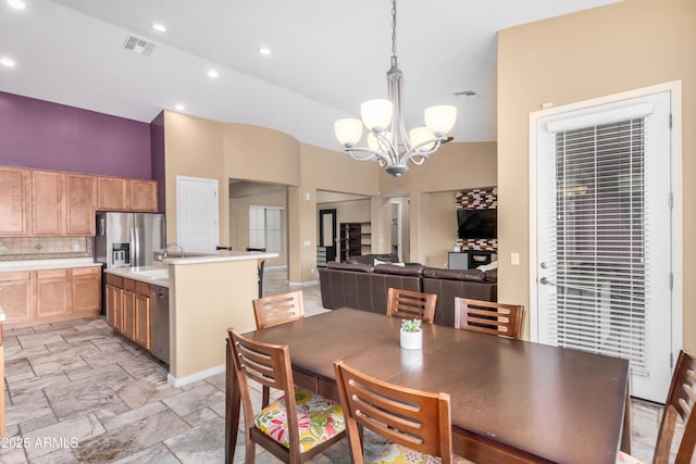 8809 S 21st St, Phoenix, AZ 85042 - dining area featuring visible vents, high vaulted ceiling, a chandelier, and stone tile floors