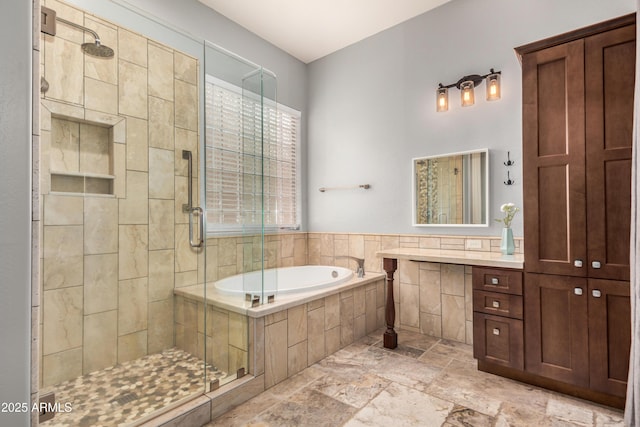8809 S 21st St, Phoenix, AZ 85042 - bathroom with a stall shower, a garden tub, vanity, and stone tile flooring