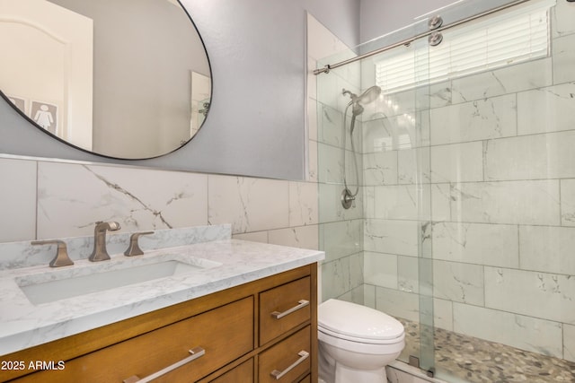 8809 S 21st St, Phoenix, AZ 85042 - full bathroom with tile walls, toilet, a shower stall, and vanity