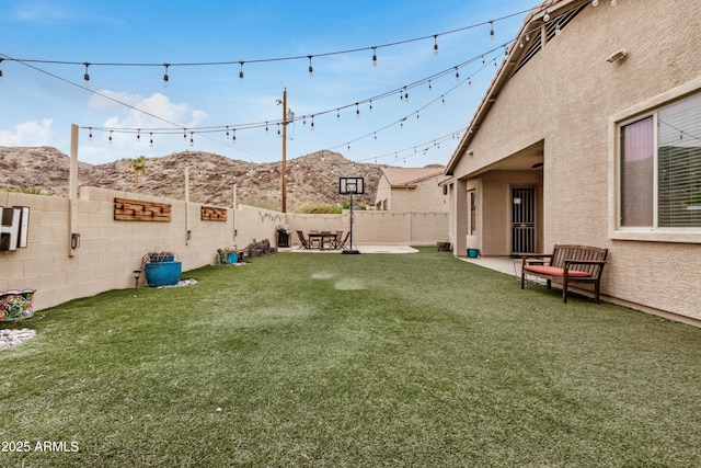 8809 S 21st St, Phoenix, AZ 85042 - view of yard featuring a mountain view, a fenced backyard, and a patio area
