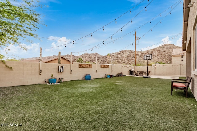8809 S 21st St, Phoenix, AZ 85042 - view of yard featuring a mountain view, a fenced backyard, and a patio area