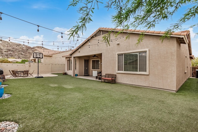 8809 S 21st St, Phoenix, AZ 85042 - back of property with a patio area, fence, a lawn, and stucco siding