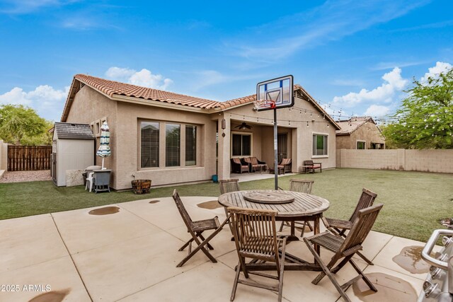 8809 S 21st St, Phoenix, AZ 85042 - view of patio / terrace with an outbuilding, a fenced backyard, a ceiling fan, and outdoor dining area