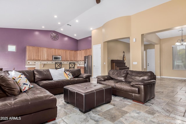 8809 S 21st St, Phoenix, AZ 85042 - living room featuring visible vents, stone tile flooring, a chandelier, recessed lighting, and high vaulted ceiling